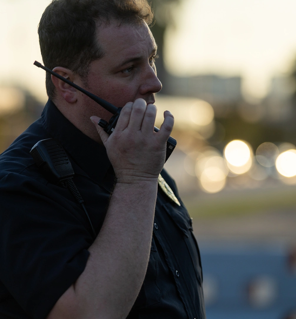 Police officer using a walkie-talkie