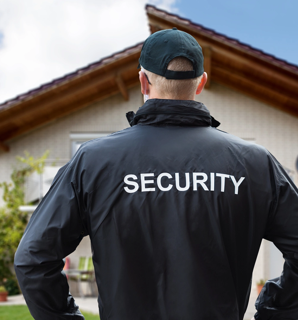 Guard in black jacket and cap