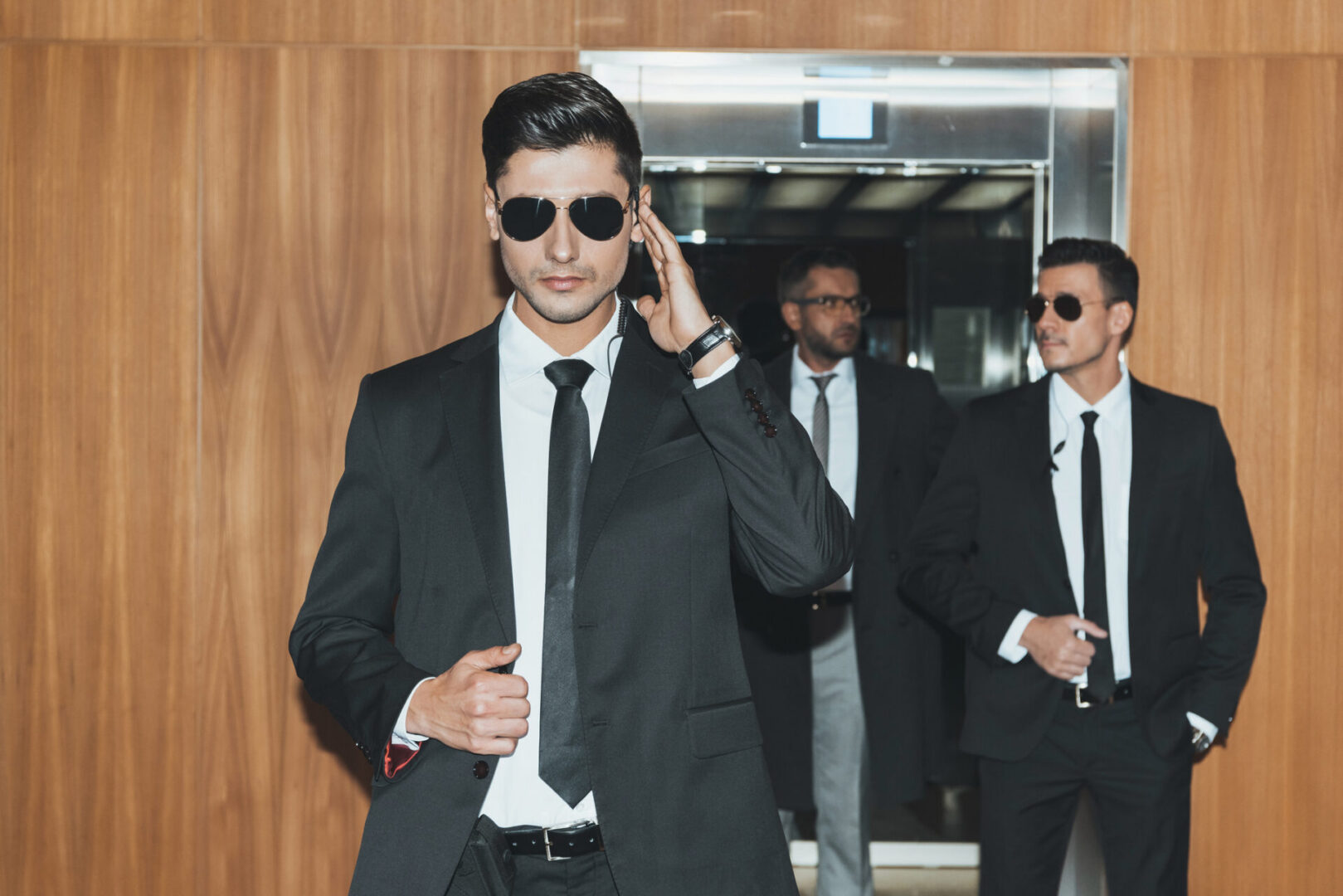 Men in suits and sunglasses