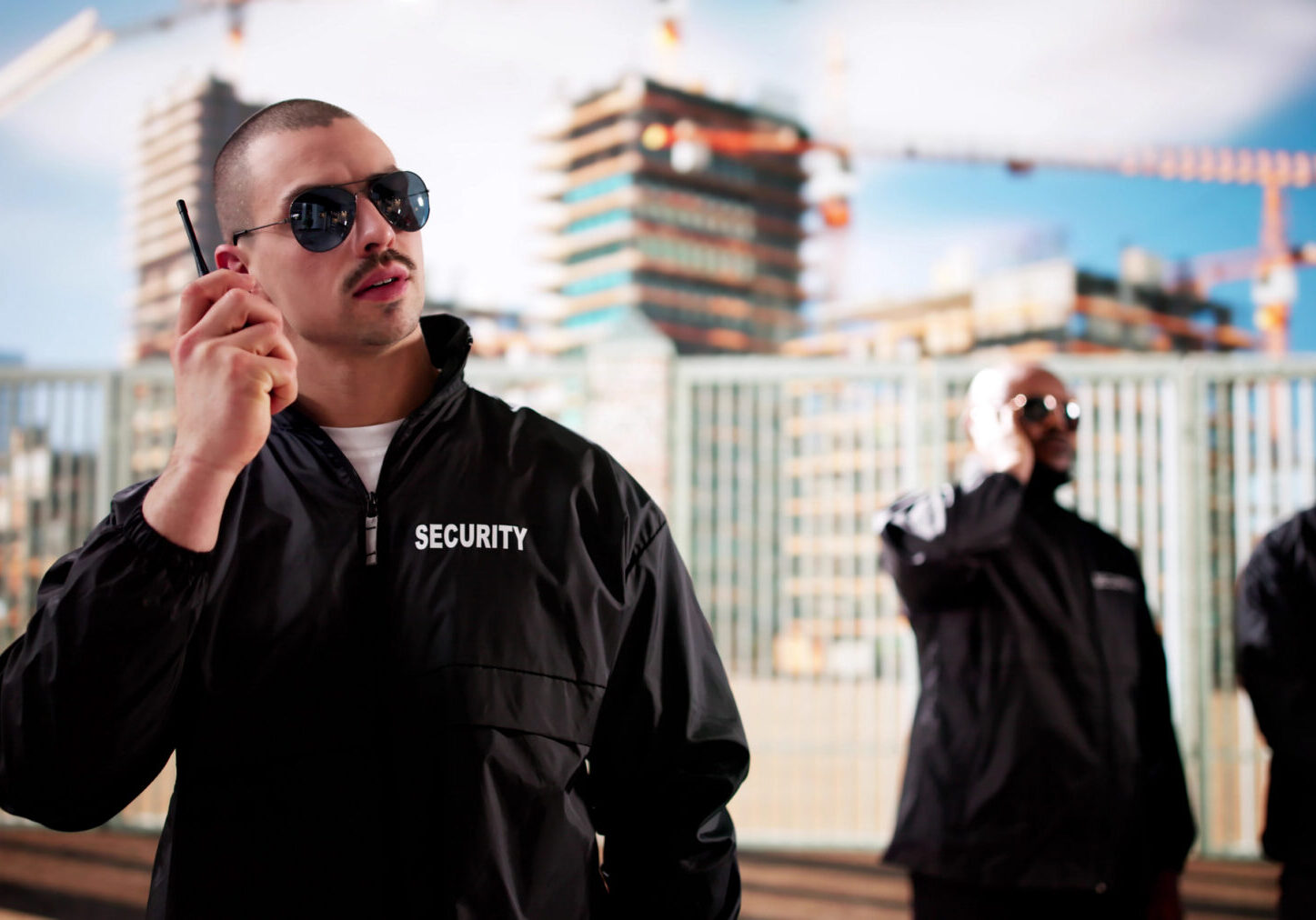 Guard with walkie-talkie and sunglasses