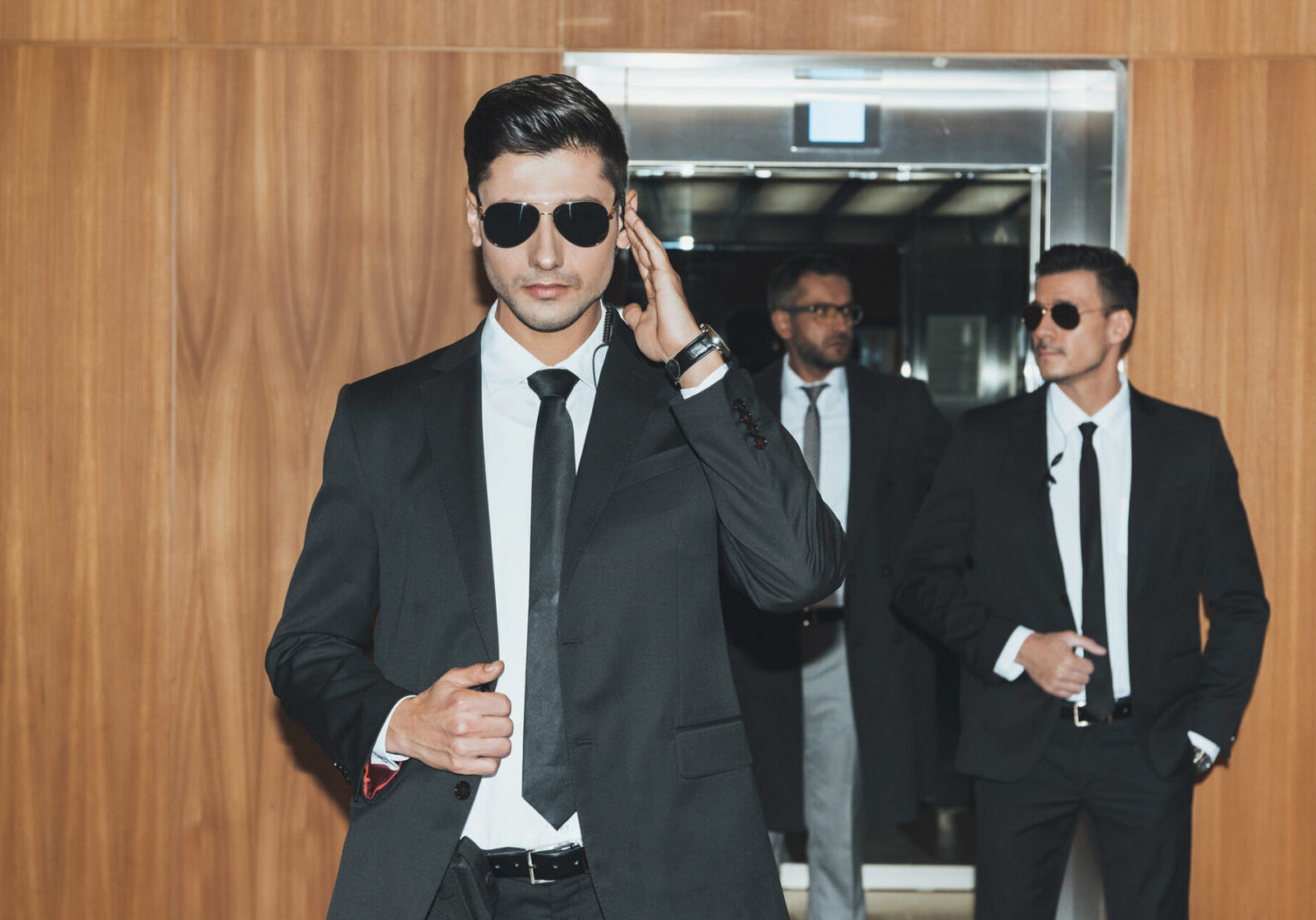Men in suits and sunglasses